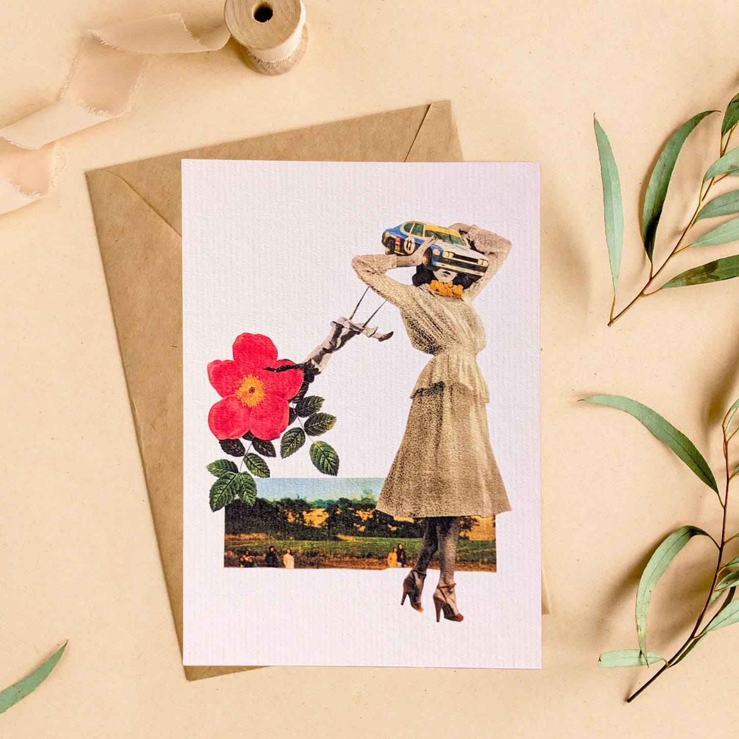 Carte reproduction collage vintage Pistacchio.illu avec enveloppe kraft, femme surréaliste tête voiture, grande fleur rouge et paysage rétro"
